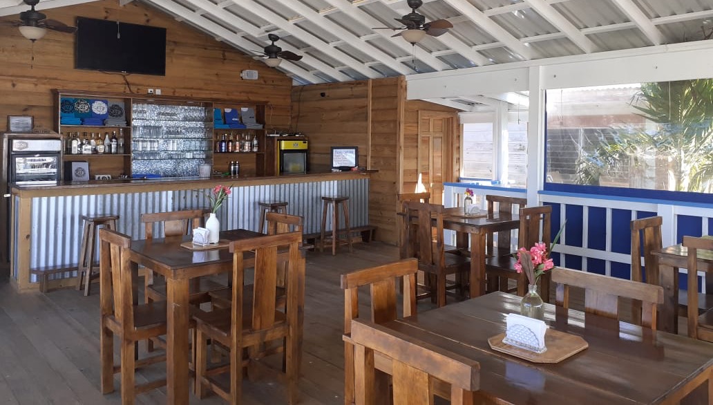 Tank'd Bar and Grill sits above Tank'd Pro Dive Center on the beautiful island of Utila, Honduras. A perfect place for scuba divers to relax after a day of diving.